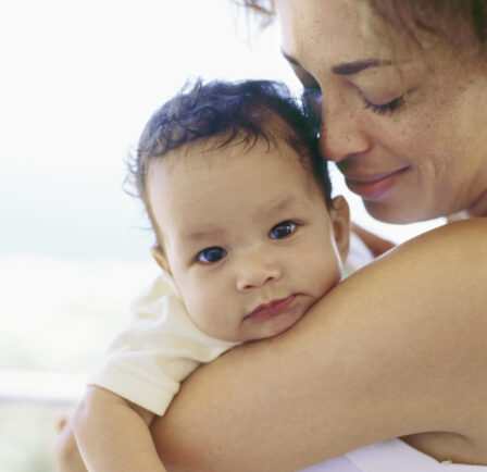 Close-up of a mother holding her baby boy
