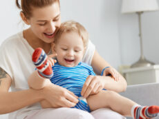 Mother and young child sharing a positive caregiving moment at home.